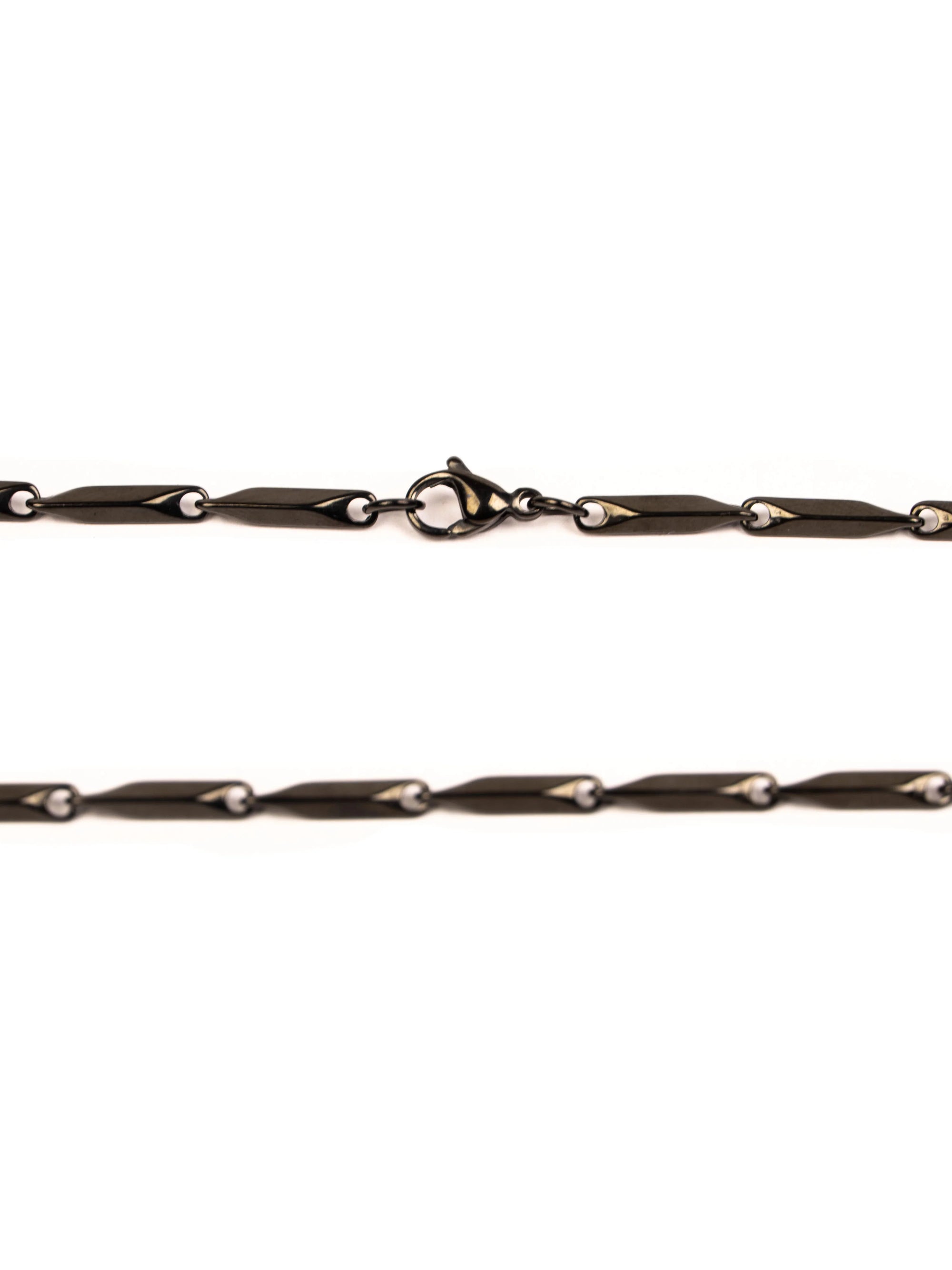 Black chain necklace on a white background stawp