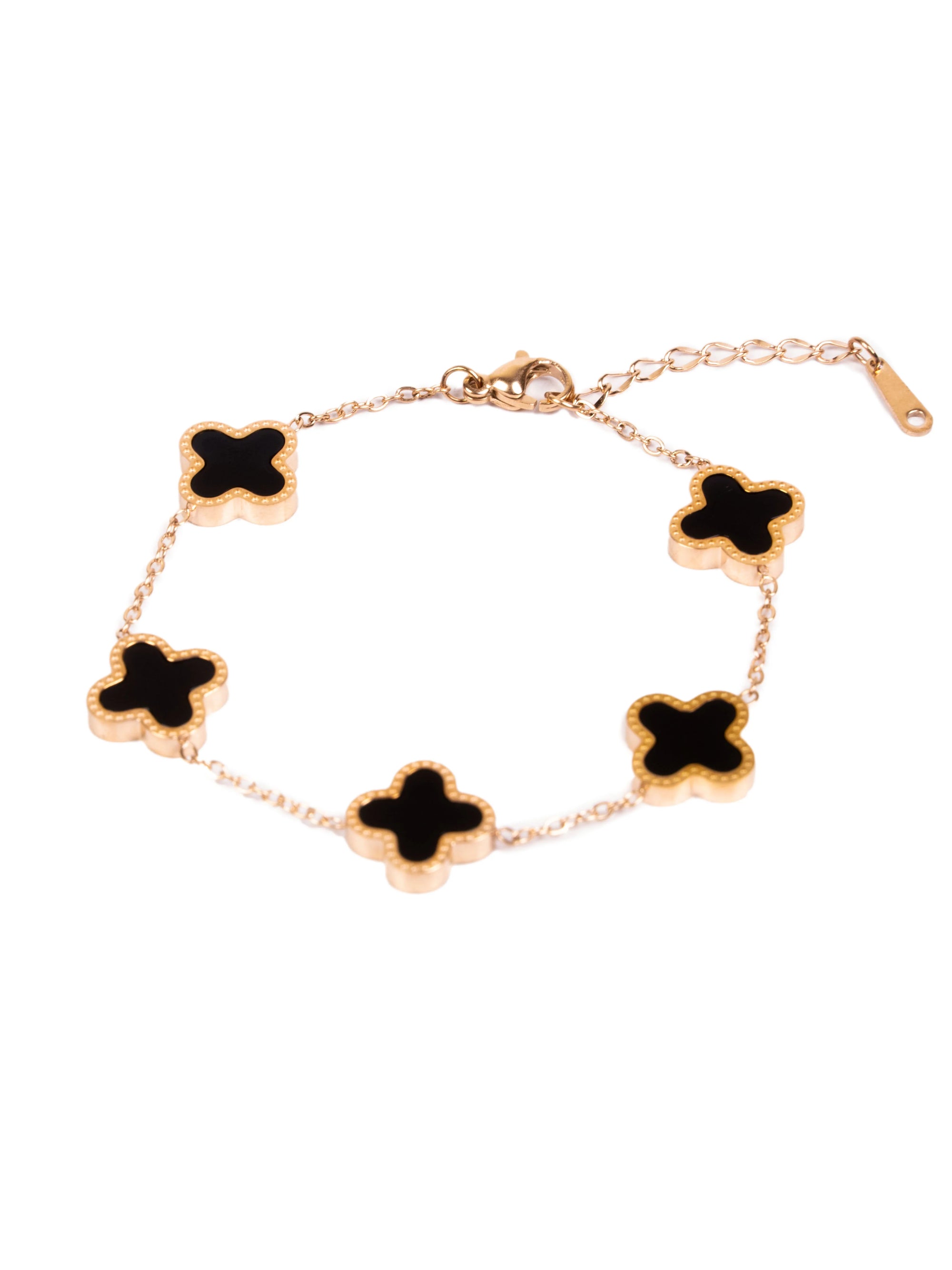 Gold bracelet with black clover-shaped charms on a white background