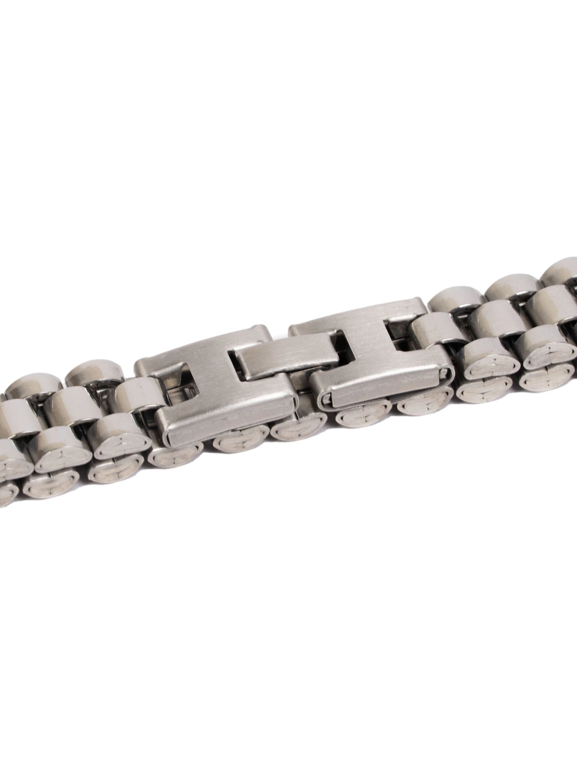Close-up of a silver metal chain bracelet on a white background