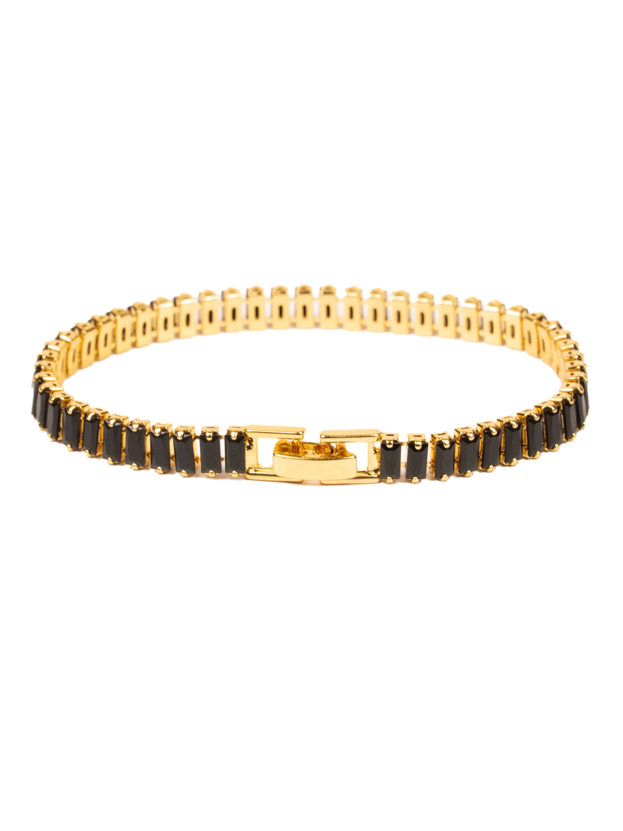 Gold bracelet with black stones on a white background