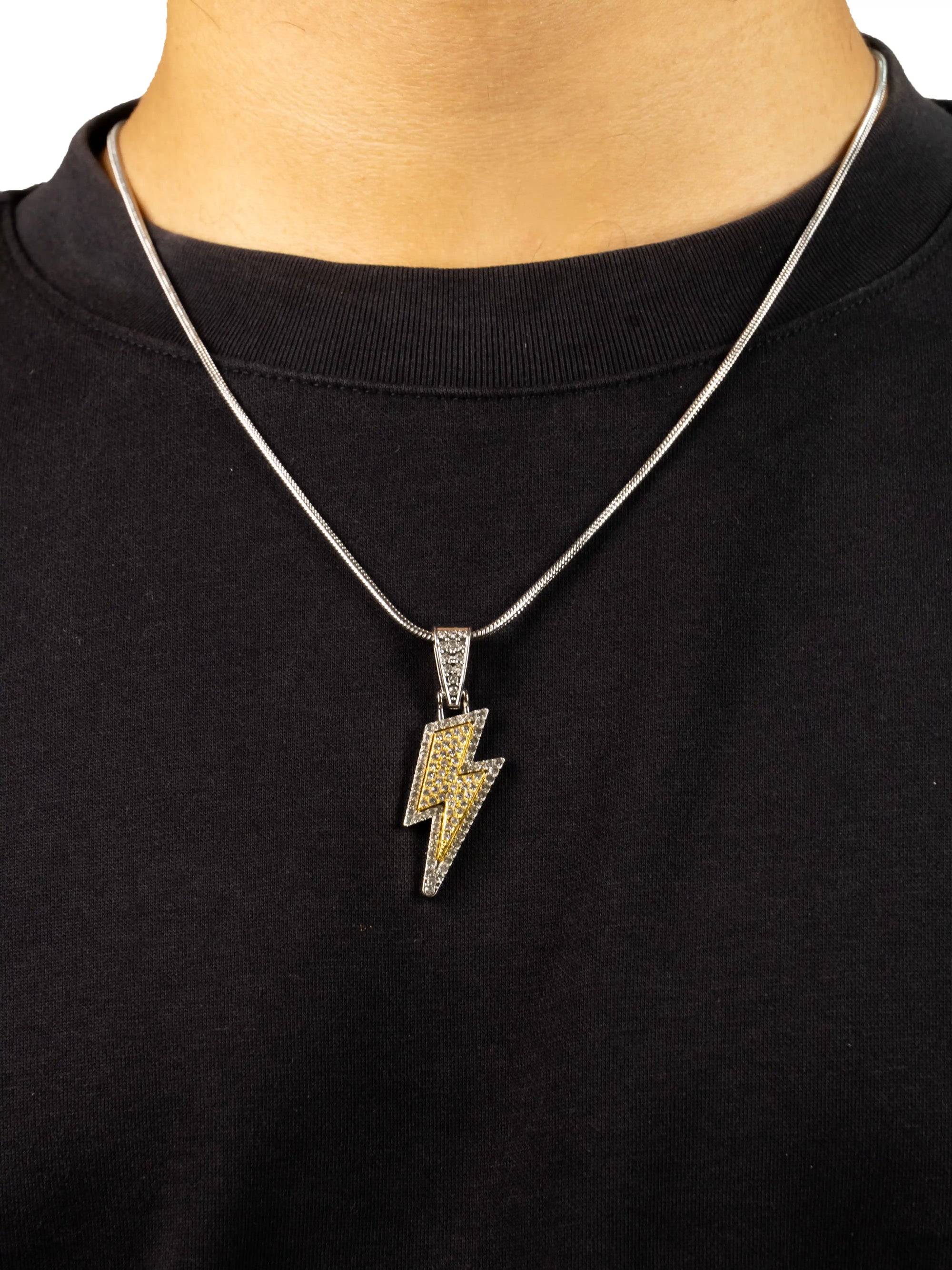 thunderbolt pendent,
Necklace with a lightning bolt pendant on a black shirt