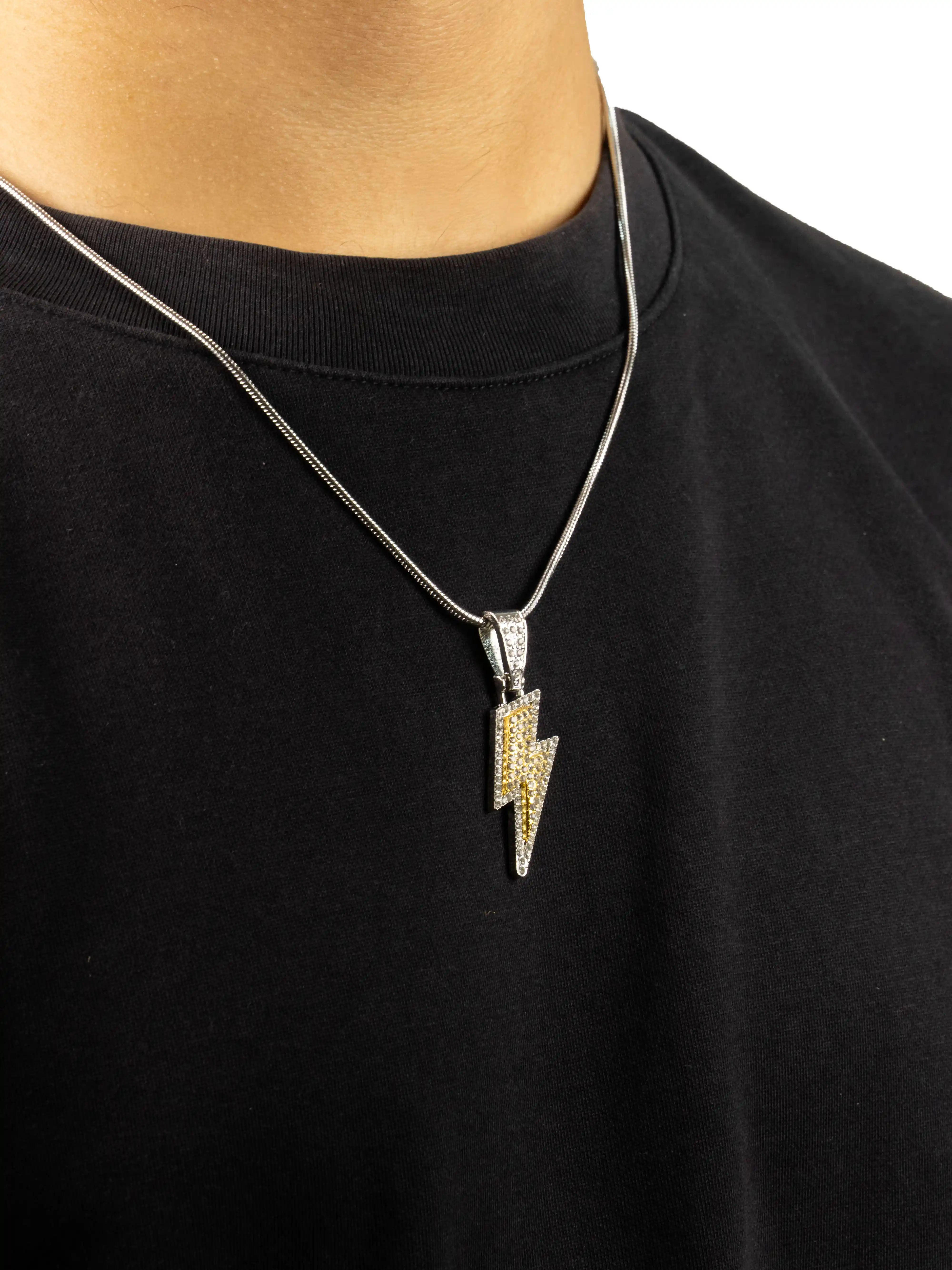 thunderbolt pendent ,Necklace with a lightning bolt pendant on a black shirt