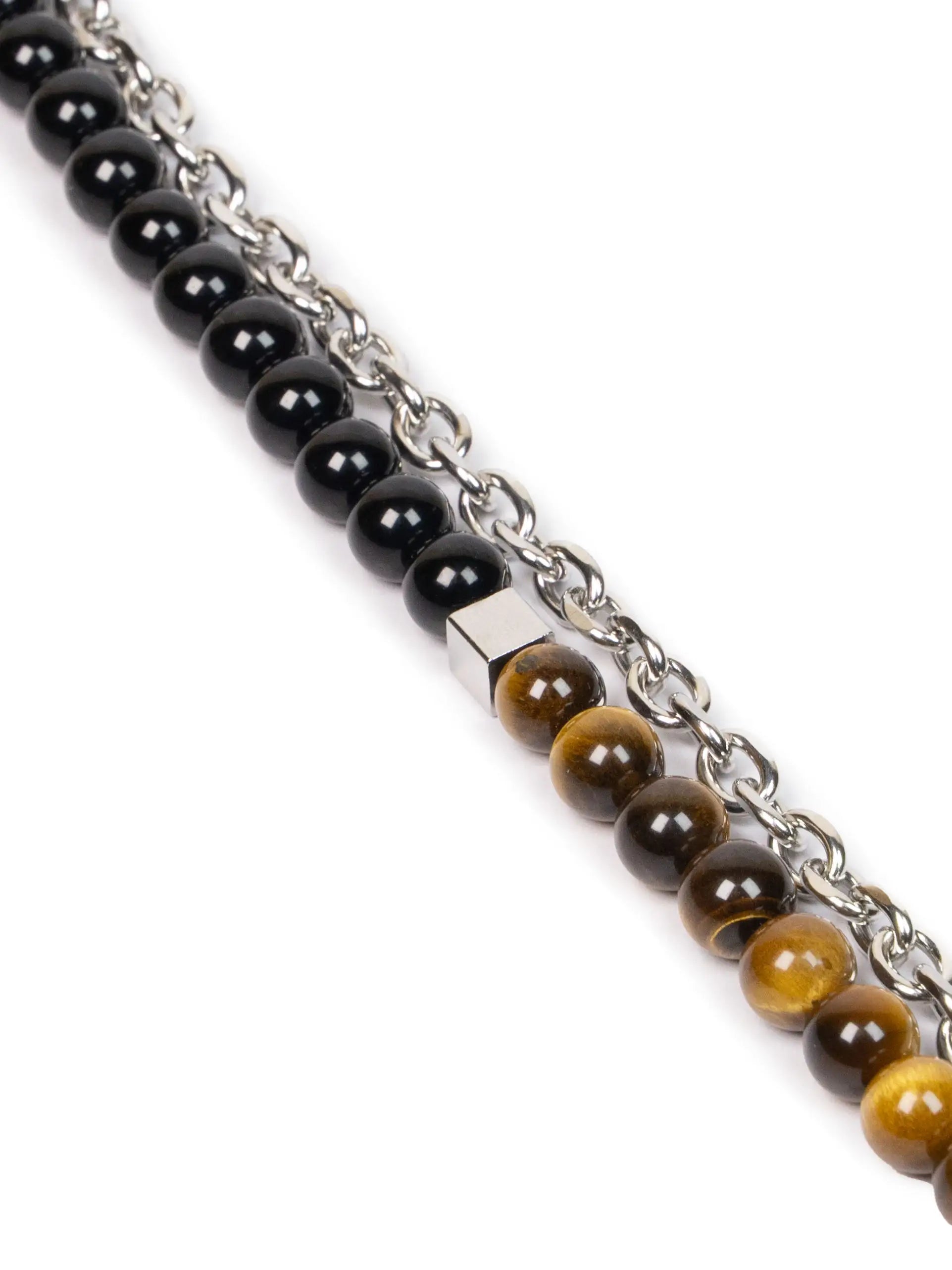 Two beaded bracelets with black, brown, and silver links on a white background