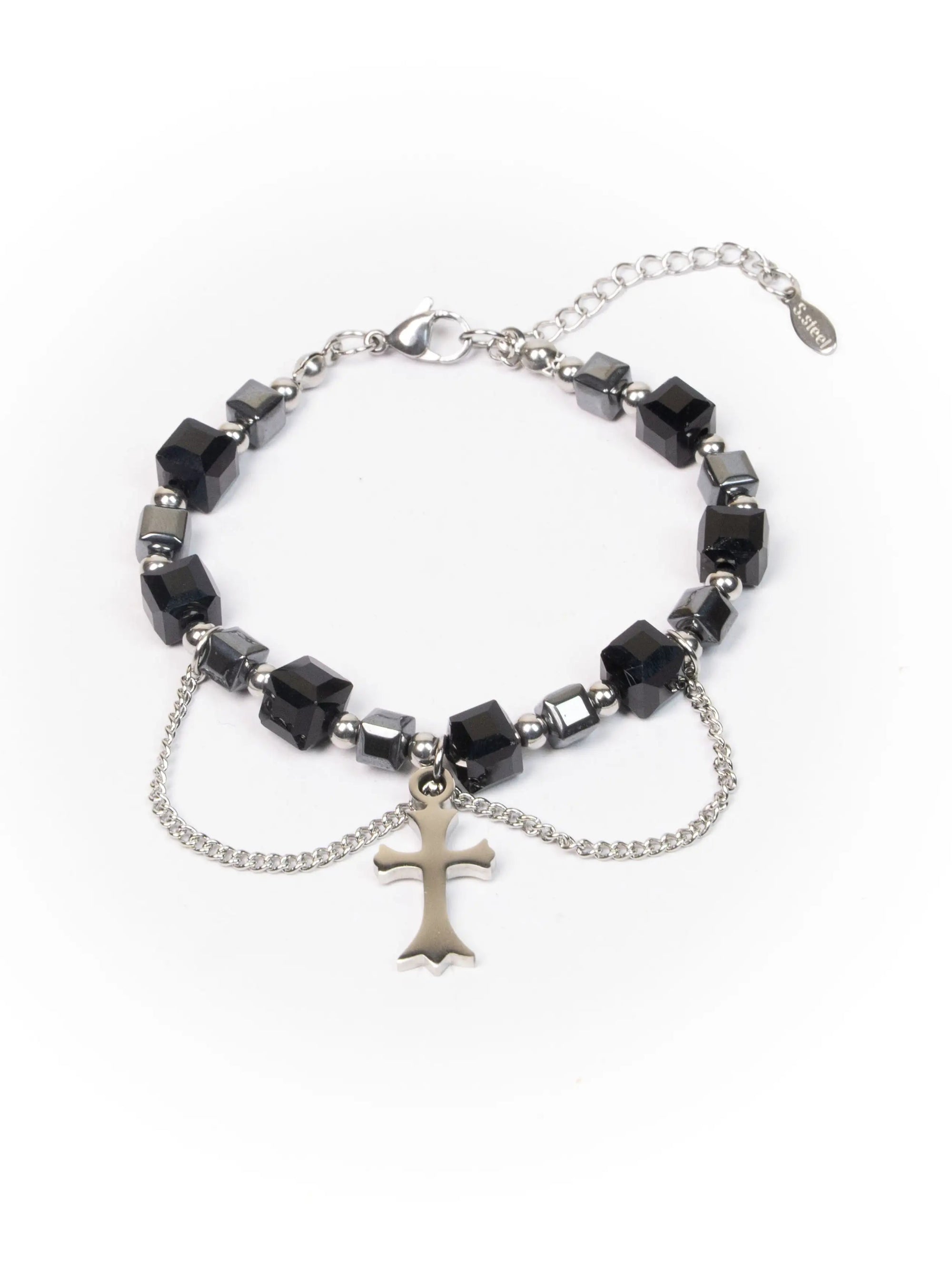 Bracelet with black beads and a silver cross charm on a white background