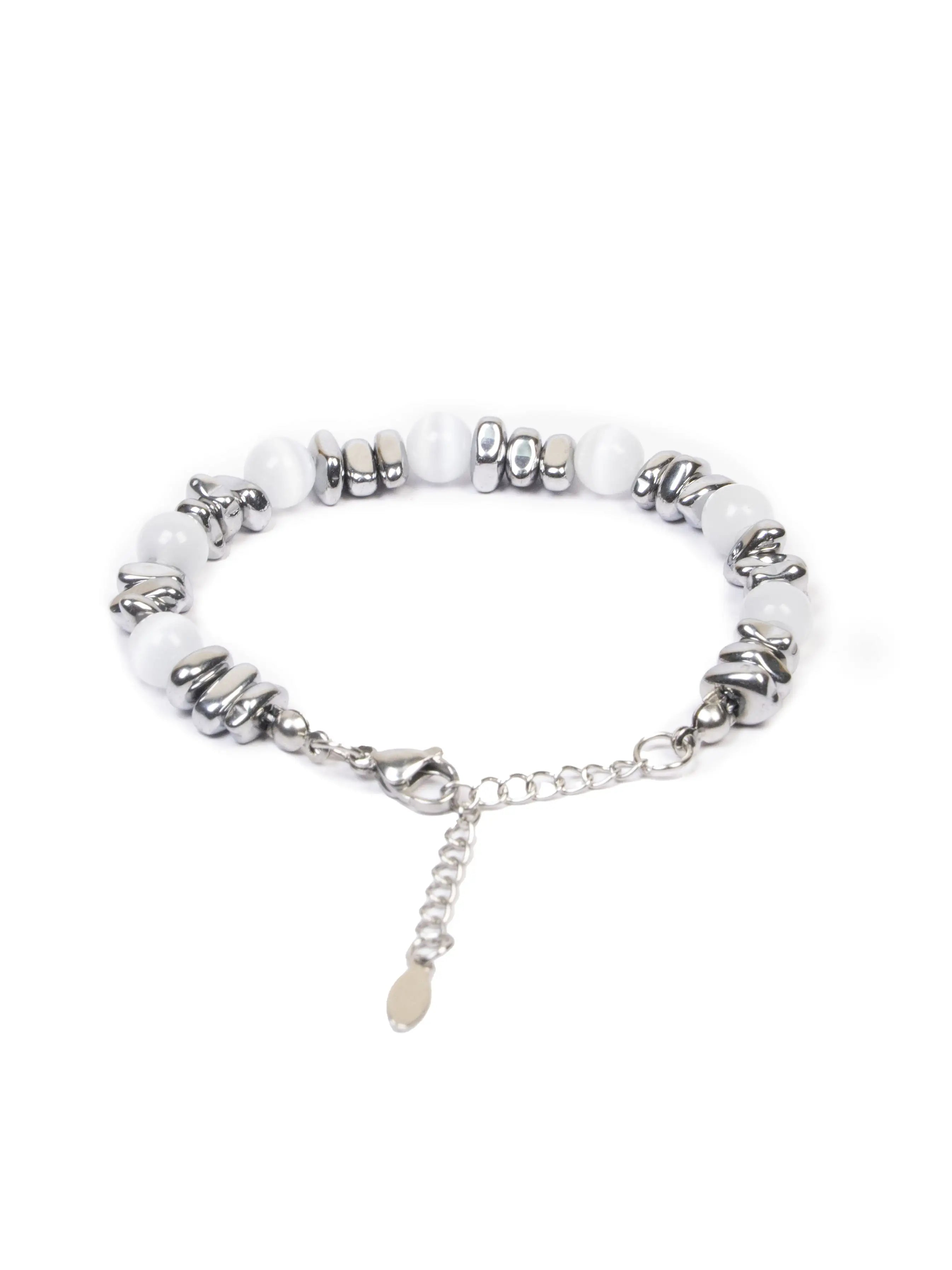 Bracelet with white beads and silver charms on a white background