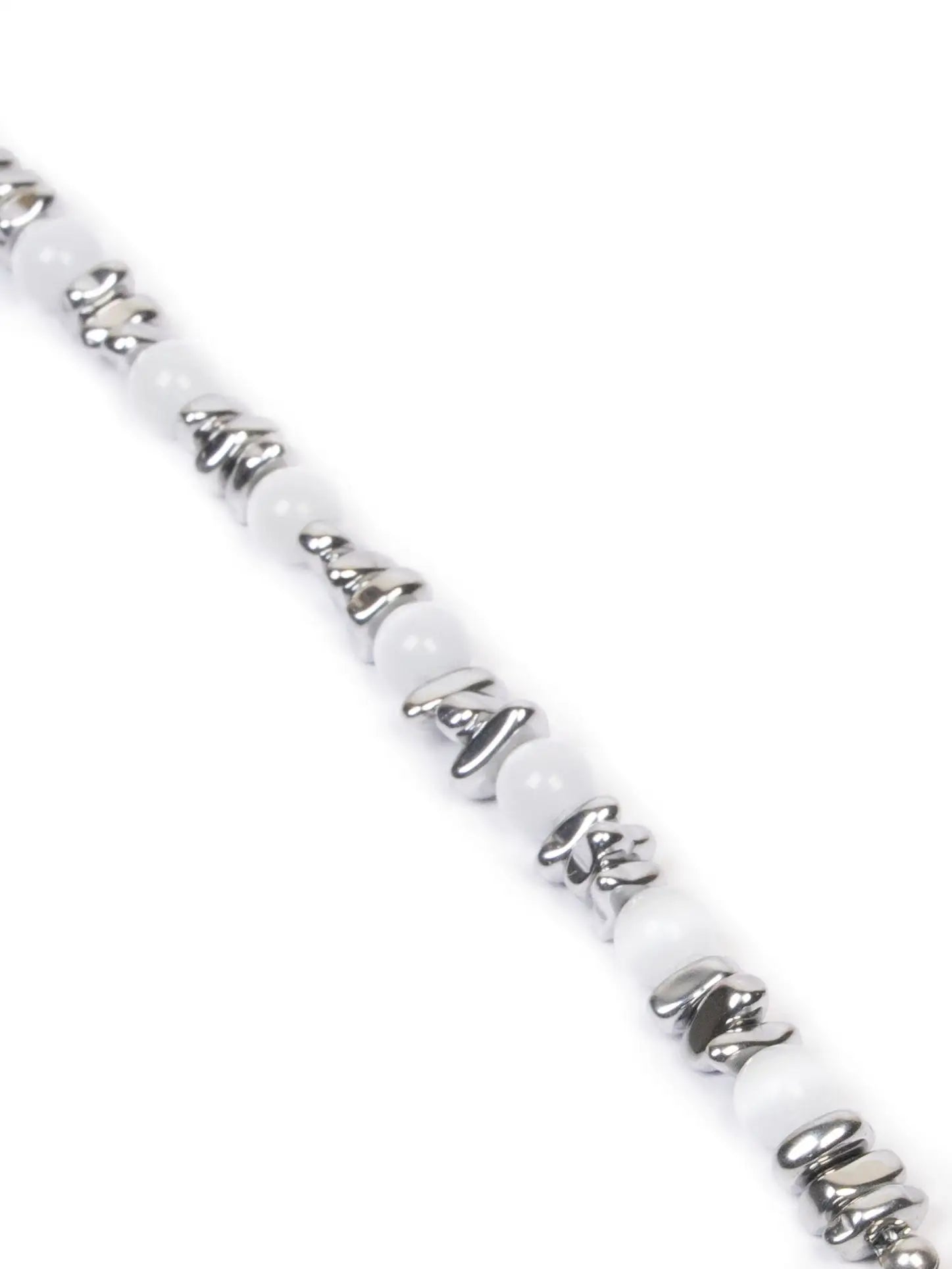 artic bracelet
Bracelet with white beads and silver accents on a white background