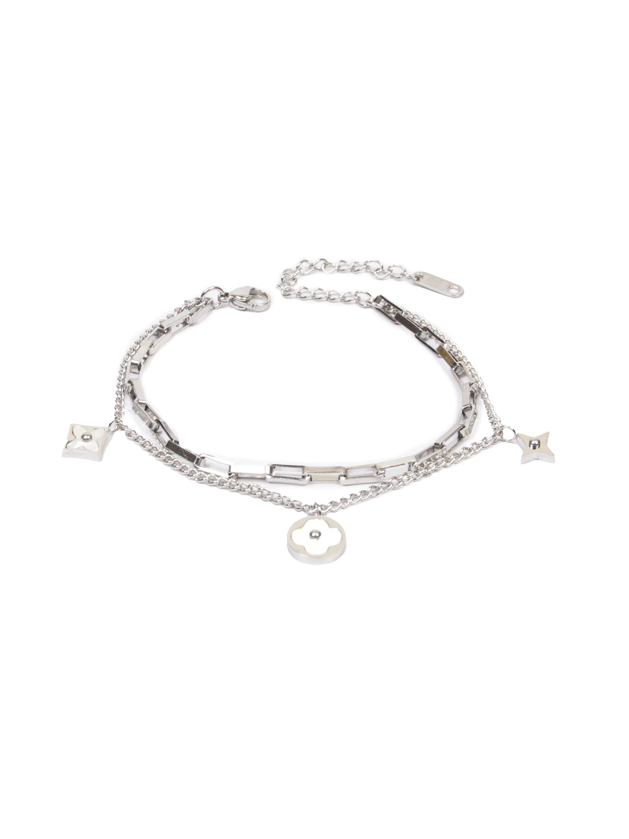 Stack of silver bracelets with various charms on a white background