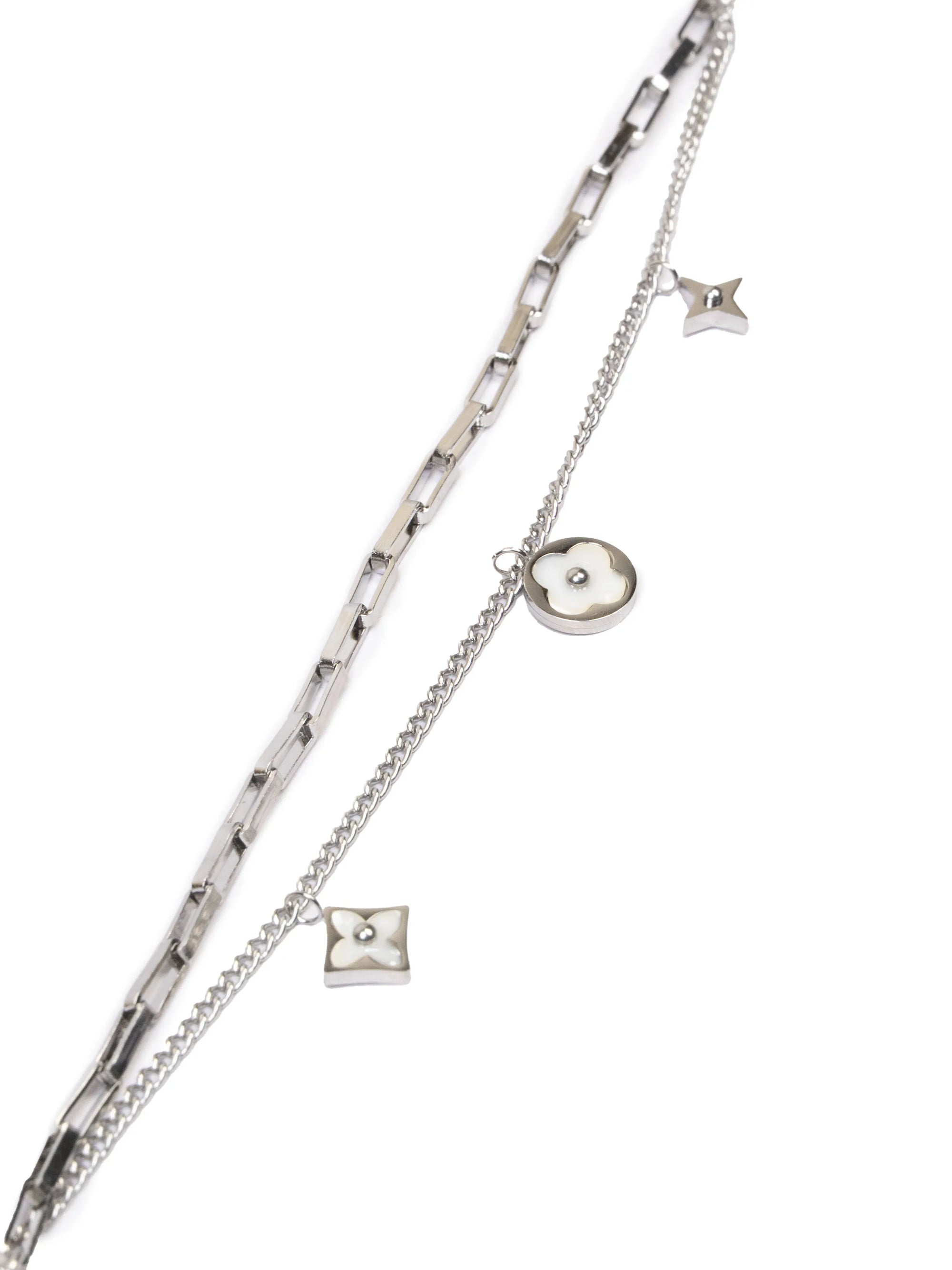 Silver chain necklace with star and square pendants on a white background