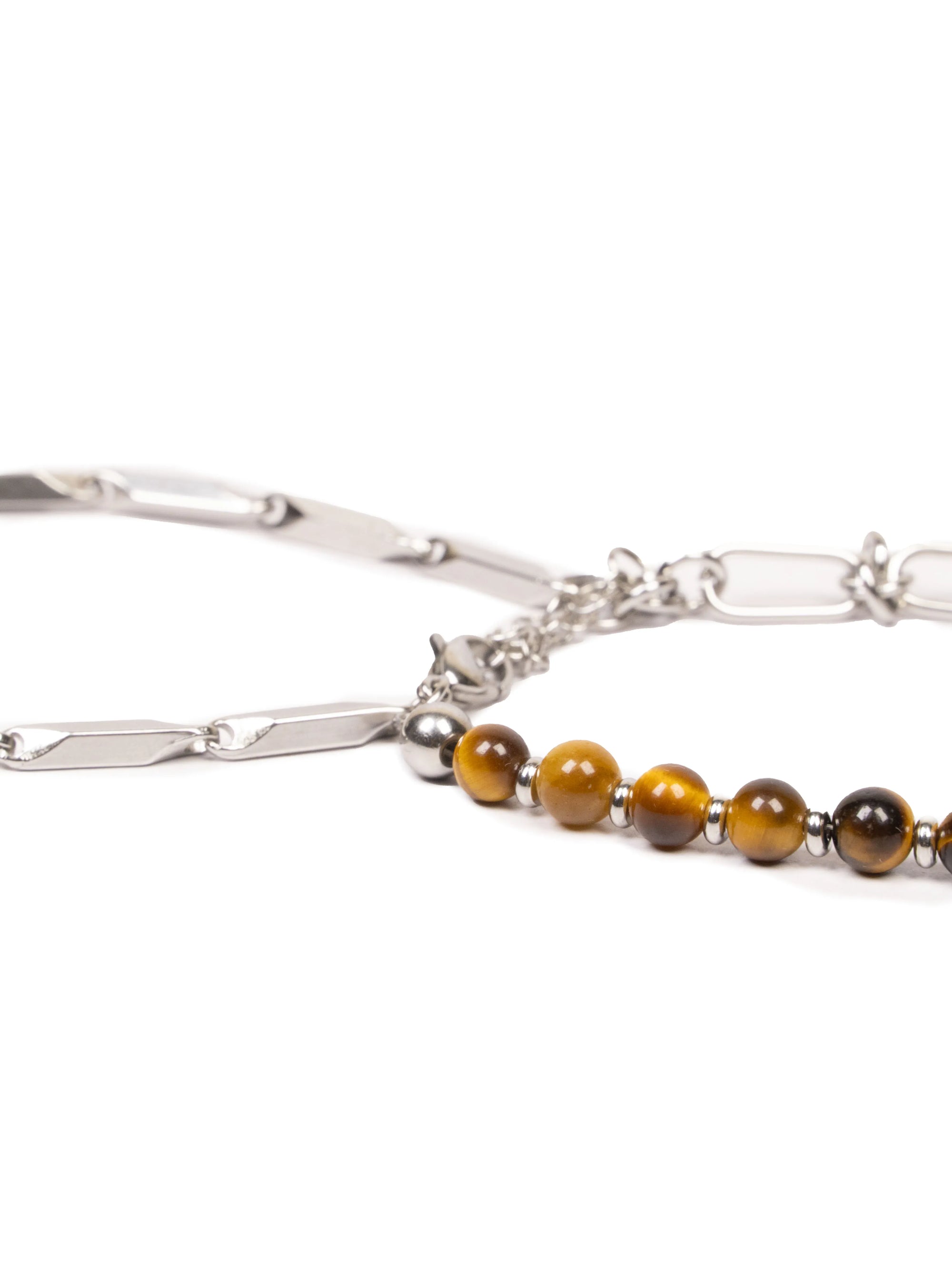 Silver bracelet with tiger eye beads on a white background