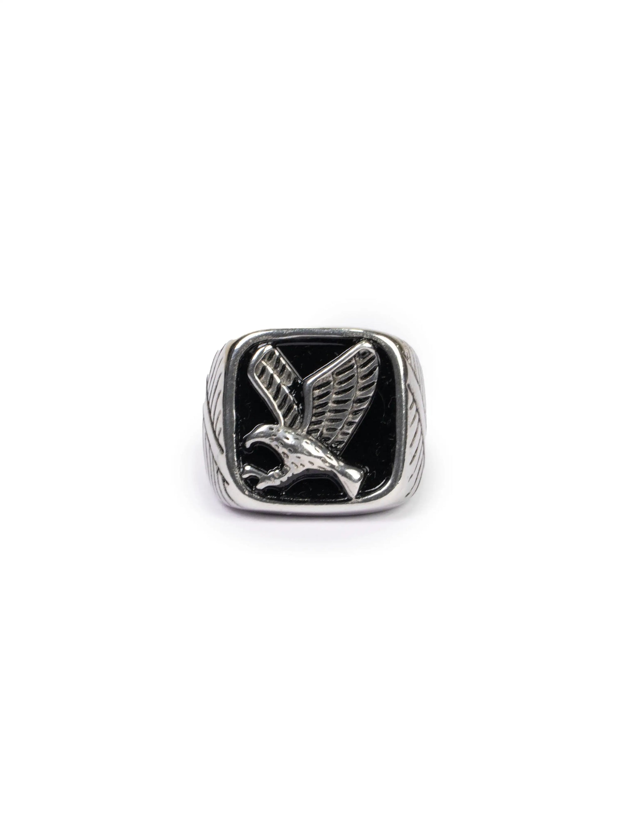 Silver ring with a black onyx eagle design on a white background