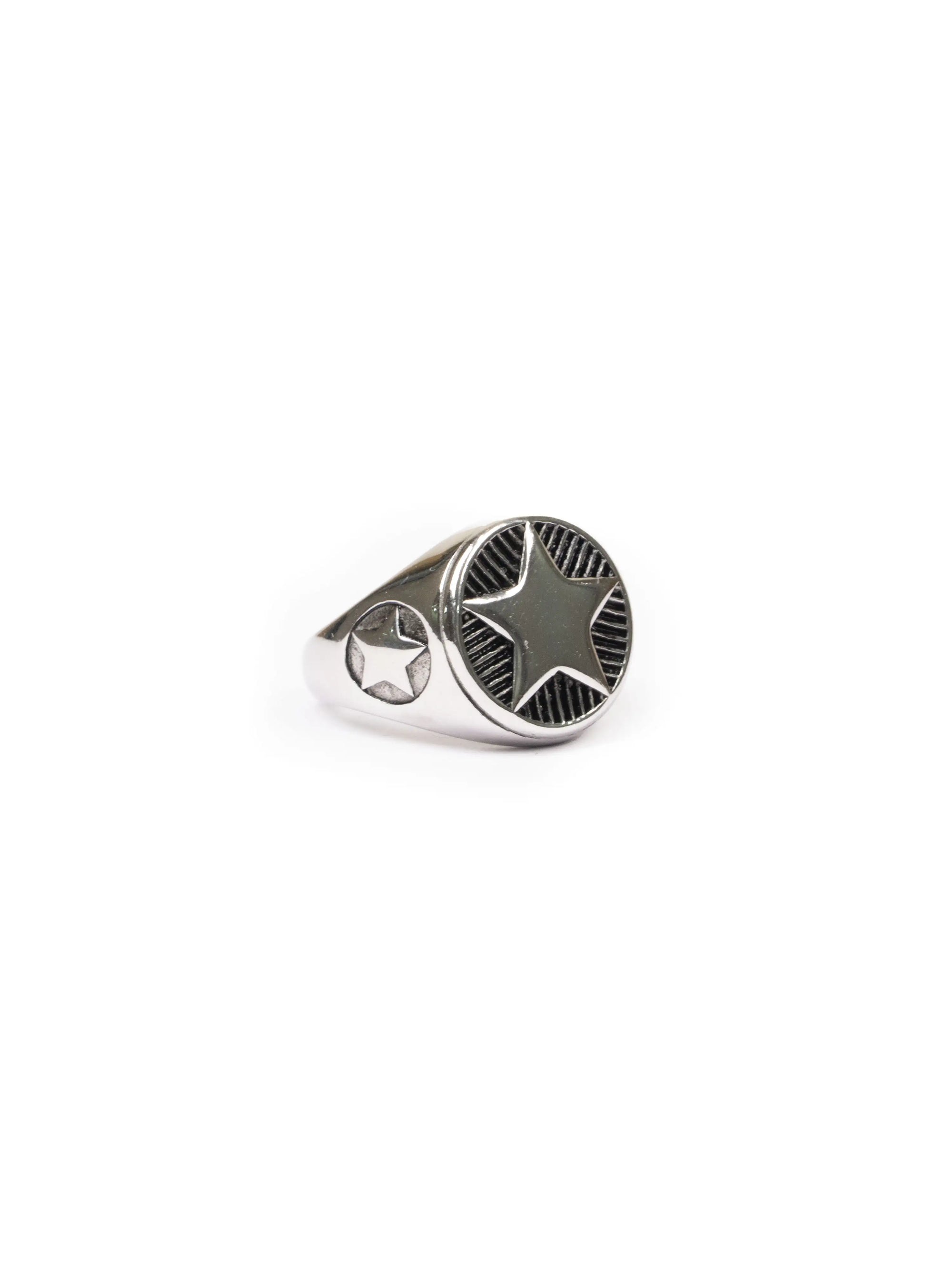 Silver ring with a black center on a white background