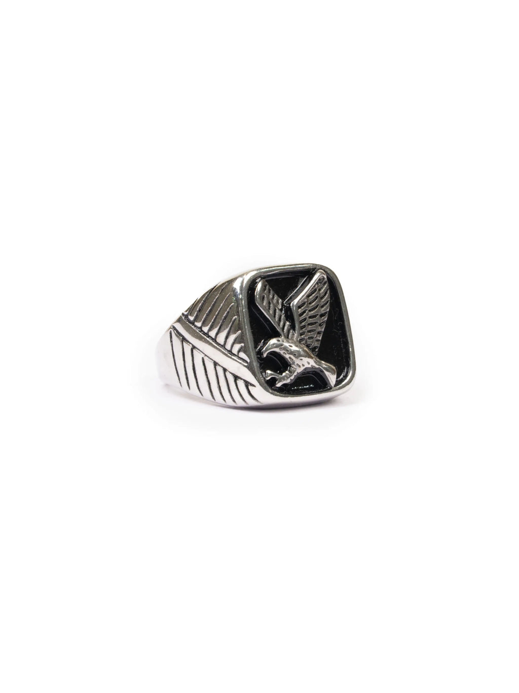 Silver ring with a eagle design on a white background