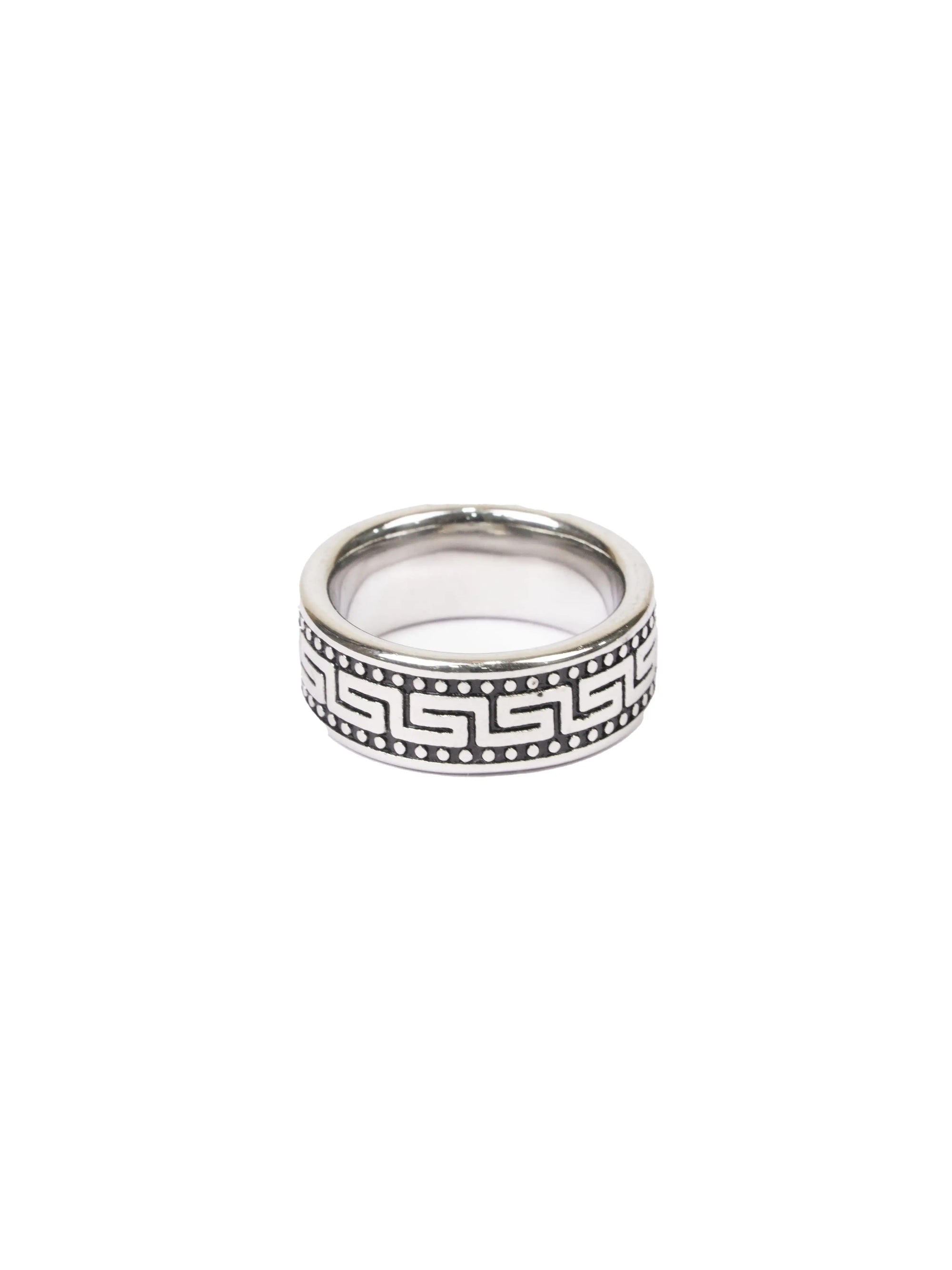 Silver ring with a black pattern on a white background
