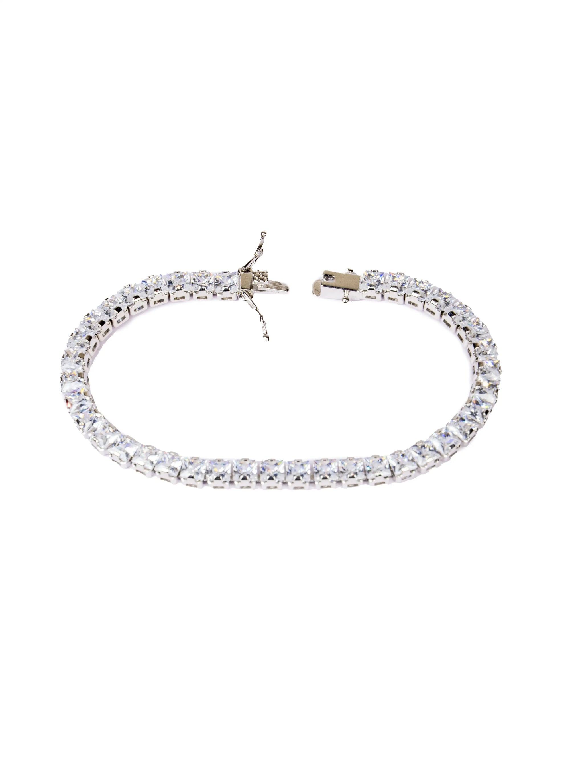 Silver bracelet with clear stones on a white background