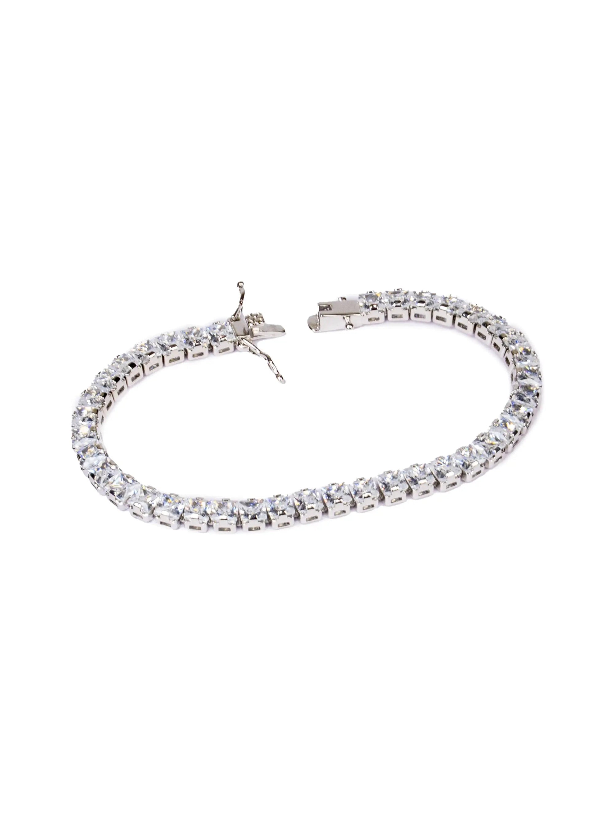 Silver bracelet with clear stones on a white background